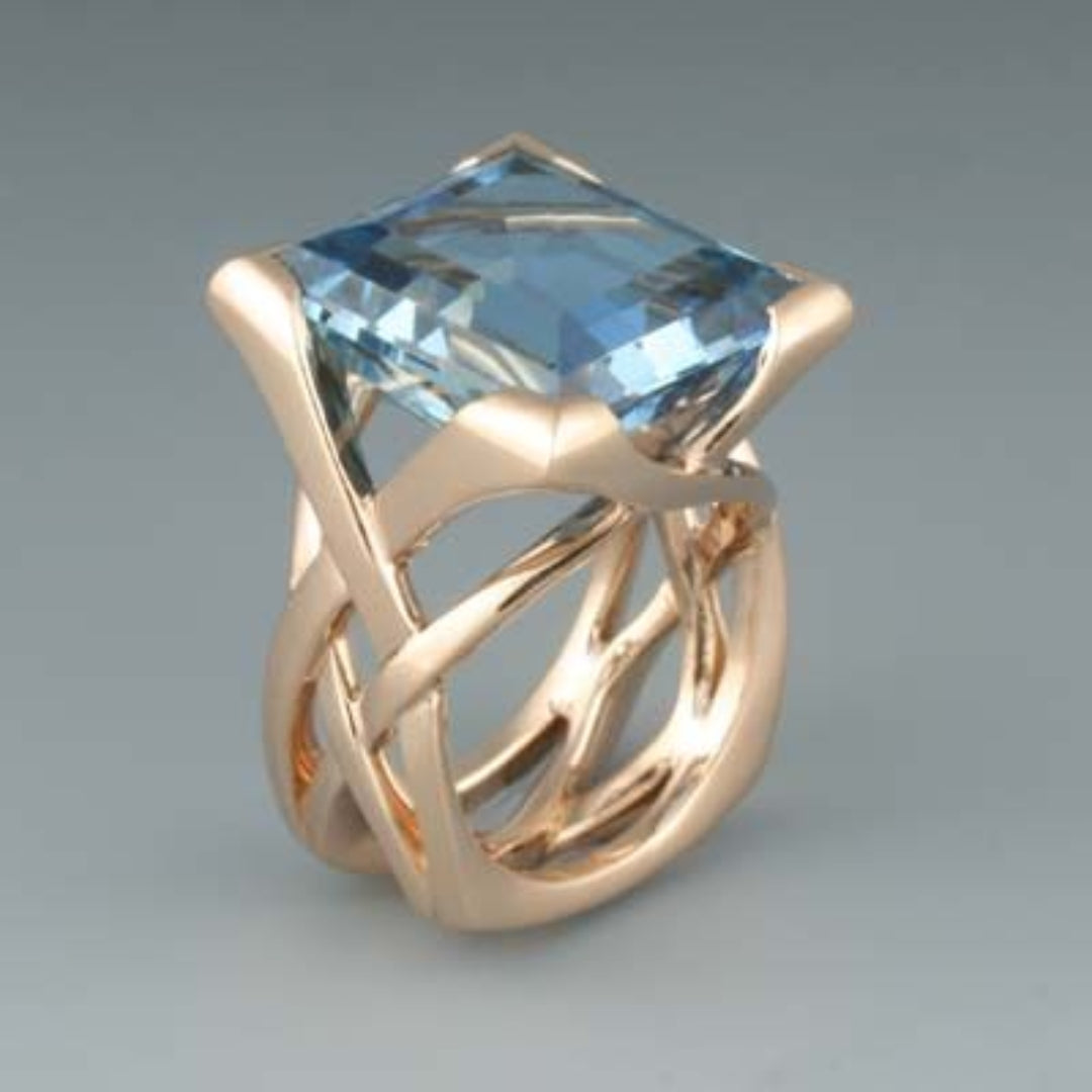 Sleek Rose Gold Blue Zirconia Ring